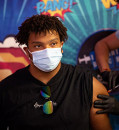 Heart risks, data gaps fuel debate over COVID-19 boosters for young people